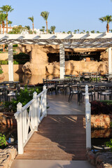 A beautiful wooden staircase in outdoor restaurant.