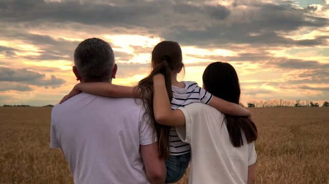 happy family, parents kid girl watching sunset, child mother father hugging sunset nature, Loving arms around family, Family goals rural scenery, Everlasting family support, edge of tomorrow, Golden