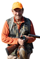 A hunter holds a pheasant in his hands. A successful hunt, a trophy game.