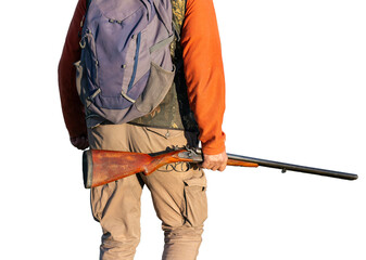 A hunter with a gun in camouflage clothing. A gentleman with a gun, medium shot, unrecognizable.