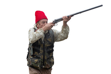 An adult hunter hunts in the autumn countryside. He fires a shotgun.