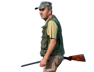 A hunter with a gun in camouflage clothing. A senior man with a gun, medium shot, searching for game.