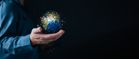 Businessman hand holding virtual world with connection lines. Global network technology and digital globalization concept for international communication and future data exchange system.