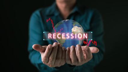 Businessman hand holding world globe with red graph down and recession text. Global economic crisis concept for financial market crash, inflation risk, and business downturn investment loss.