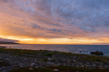 Russia, Murmansk region, Rybachy Peninsula. Sunset on the Barents Sea coast. August 2025