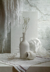 Still life with white dishes on a light background