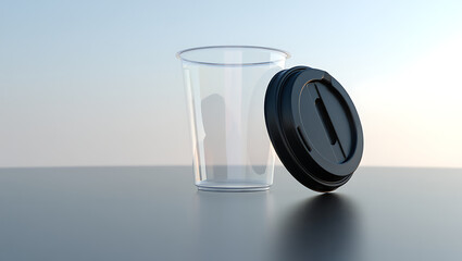 Clear plastic cup with black lid on gray surface