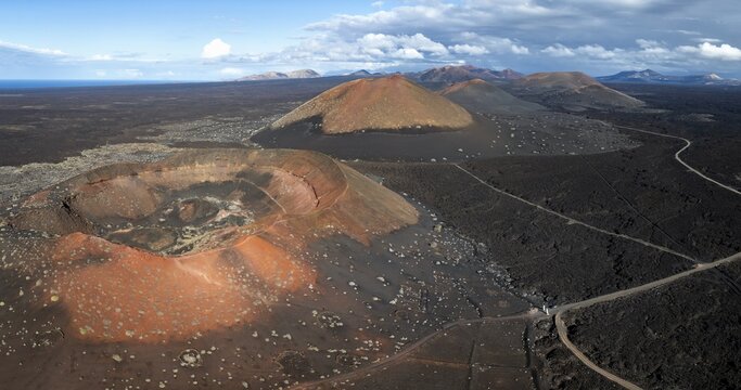 Monta&ntilde;a Quemada and Monta&ntilde;a Pedro Perico volcanoes, volcanic landscape with craters and lava fields, aerial view, Lanzarote, Canary Islands, Spain