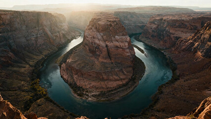 An aerial view of a winding river cutting through a canyon with steep rock walls. travel magazines, destination branding, designed for travel destination branding.