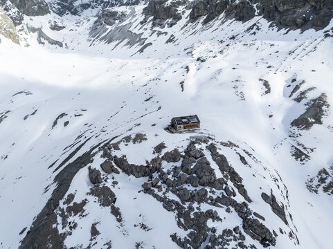 Aerial view, winter in the mountains, Chamanna Jenatsch CAS, Swiss Alpine Club hut, Val Beve, Grisons, Switzerland