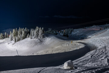 Ski resort illuminated at night in winter