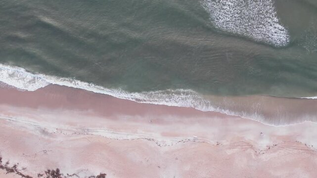 Aerial view of the meeting point between the ocean and beach creating a dynamic contrast of colors and textures, St. Augustine, Florida, United States.