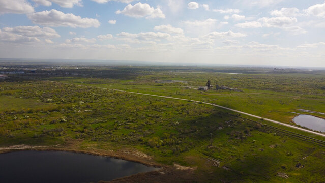 Aerial Landscape of an Abandoned Mine Shaft Headframe in Rural Terrain
