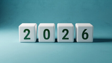 Obraz premium The year 2026 written on white blocks on blue background