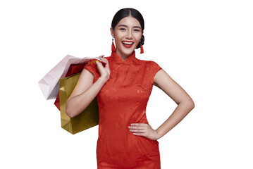 Chinese New Year shopping celebration with Asian woman in red traditional dress holding shopping bags expressing festive happiness cultural elegance holiday lifestyle. PNG file