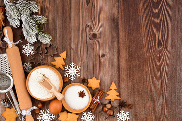 Festive Christmas background. Gingerbread baking preparation on a rustic wooden table during the holiday season