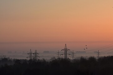 Sunrise over the city in the early morning. Winter fogy landscape