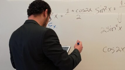 Man Writing a Trigonometric Identity on a Board - Powered by Adobe