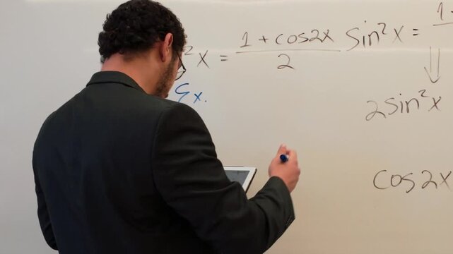 Man Writing a Trigonometric Identity on a Board
