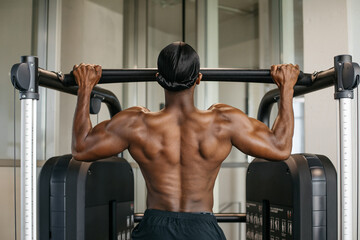 Training cross fit.
Strong and healthy man working out inside a cross-fit gym.