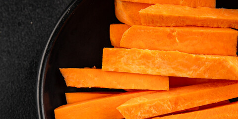 Raw sweet potato slices tasty snack fresh delicious gourmet food table background rustic top view...