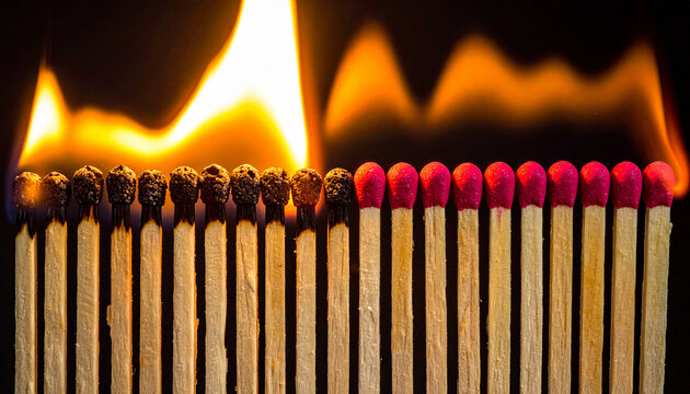 Row of burnt matches transitioning to unburnt matches with red heads and flames burning - Powered by Adobe
