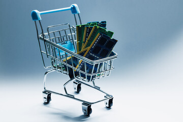Laptop ddr 3 memory sticks in toy shopping cart on white background  © Dmytro Hai