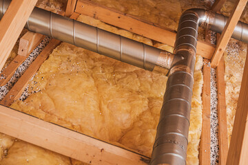 Insulation and Ductwork in Residential Attic Space During Home Renovation