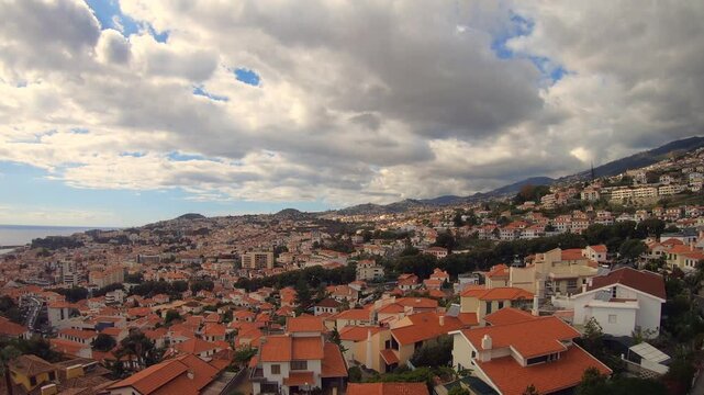 The capital of Madeira, Funchal, seen from a cable car. Time-lapse 4K Video