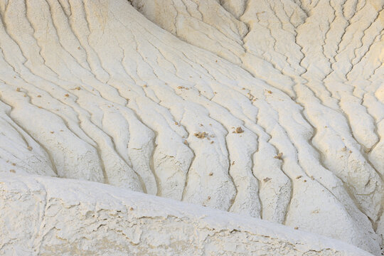 View of the arid landscape, etched with intricate patterns of erosion, revealing the raw beauty of the desert terrain, Senek, Mangystau Region, Kazakhstan.