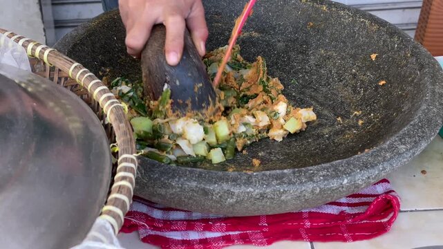 Lotek traditional Indonesian vegetable salad being prepared