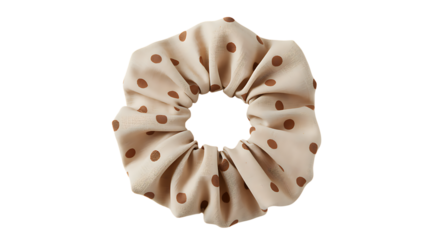A beige and brown polka dot scrunchie isolated perfect for hair accessories on transparent background.