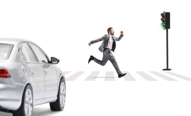 Businessman running fast in front of a car