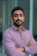 Man posing confidently outdoors in a casual setting