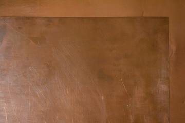 Copper plates, in a geometric arrangement. Space for writing. Minimalism.