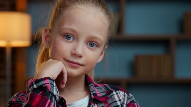 Portrait Caucasian cute smiling kid daughter child girl looking at camera smile at evening home happy adorable positive carefree face baby posing indoors primary school education childcare childhood