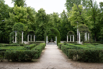 Tranquil garden pathway with classical architecture
