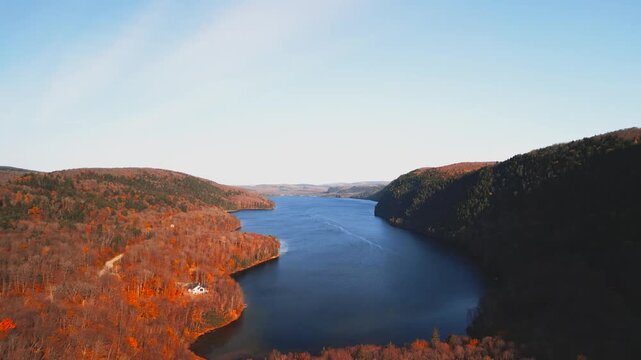 Lac-du-Sable, Canada - Oct.19 2025: The colourful autumn foliage 4k drone aerial view of Lac-du Sable in Quebec Canda