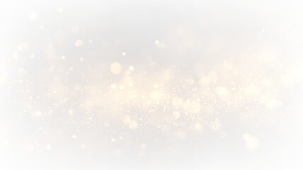 Gold particles float on a transparent background creating a bright and shimmering effect during a festive celebration or event