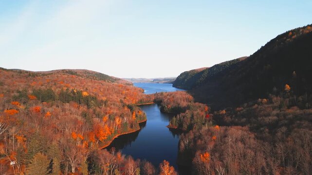 Lac-du-Sable, Canada - Oct.19 2025: The colourful autumn foliage 4k drone aerial view of Lac-du Sable in Quebec Canda