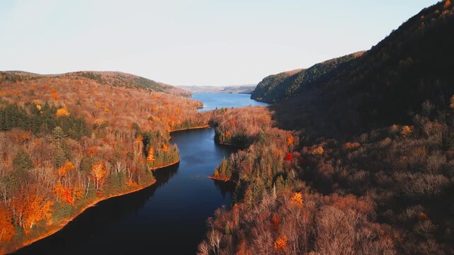 Lac-du-Sable, Canada - Oct.19 2025: The colourful autumn foliage 4k drone aerial view of Lac-du Sable in Quebec Canda