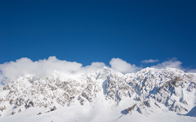 the splendid winter in the Dolomites with the snow-capped mountain peaks