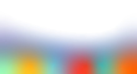 A blurred image of a colorful abstract scene viewed from a distance with vibrant hues and soft focus