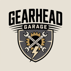 Gearhead Garage shield logo with crossed wrenches, gear and lightning bolt, rugged automotive repair emblem vector for workshop, custom mechanic branding