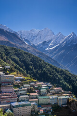 High-rise lodges and hotels in Namche bazaar, a capital of Khumbu region, against Kusum Khangkaru peak. Himalaya mountains, Nepal.