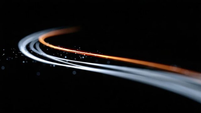 Illuminated Path: Abstract light trails dance across a deep black expanse, their vibrant colors charting a dynamic course. These bright lines symbolize direction, change, and the pursuit of progress.