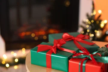 Fotobehang Diamanten Beautiful Christmas gifts and festive decor on wooden table indoors, space for text. Bokeh effect  © New Africa