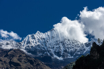Mt. Thamserku with white cloud and blue sky. Everest base camp in Himalaya mountains, Nepal.