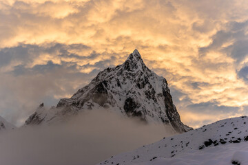 Mt. Cholatse summit at sunset under the cloudy sunset sky. View from Thokla (Dughla).