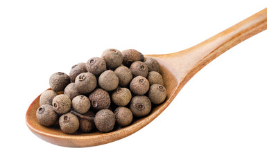 Allspice peas in a wooden spoon close-up on a white. Isolated